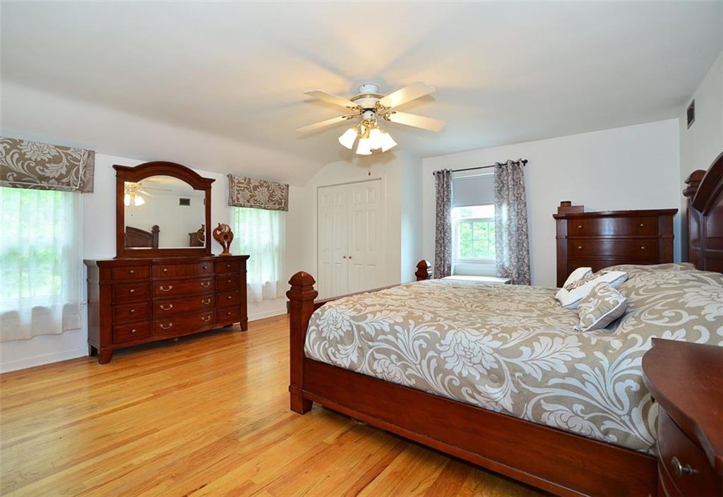 10550 Grubbs Road Wexford, PA 15090 - Photo 13 of 25 Master suite features hardwood floors, plenty of windows and walk in and wall closets.