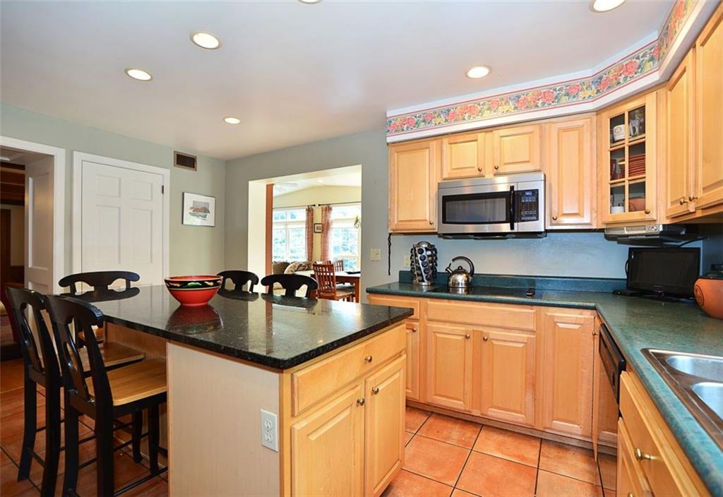 Kitchen offers plenty of cabinets, counter space and 2 pantries.