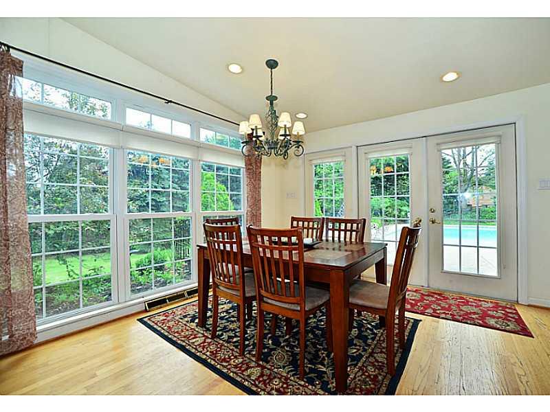 10550 Grubbs Road Wexford, PA 15090 - Photo 10 of 25 Sunroom offers sunshine along with custom made blinds,cathedral ceilings and access to backyard and patio.