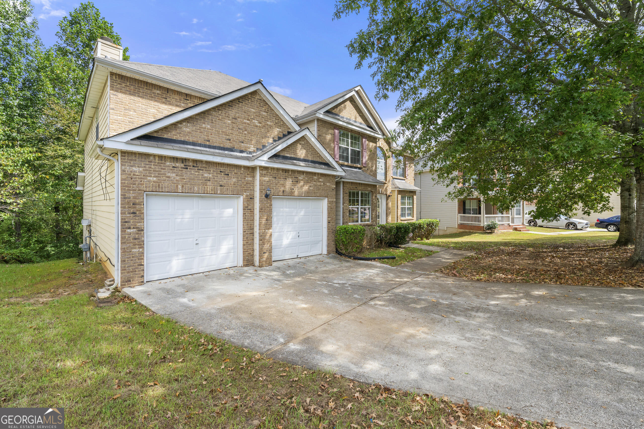 1152 Stepping Stone Lane Conyers, GA 30012 - Photo 1 of 9 a view of a house with a yard and garage