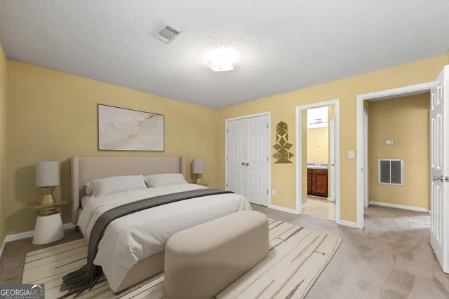 a room with a bed and a chandelier