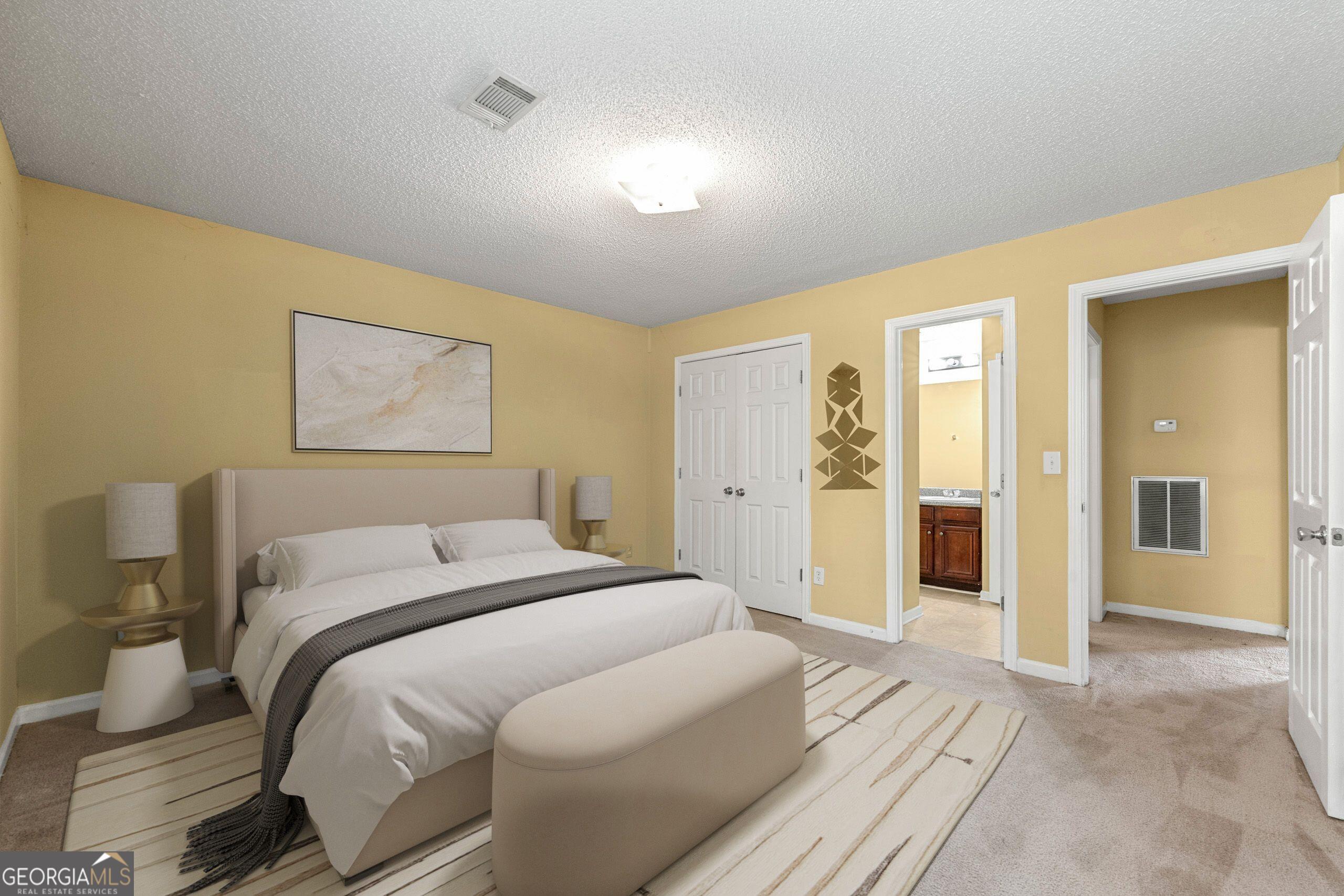 1152 Stepping Stone Lane Conyers, GA 30012 - Photo 2 of 9 a room with a bed and a chandelier