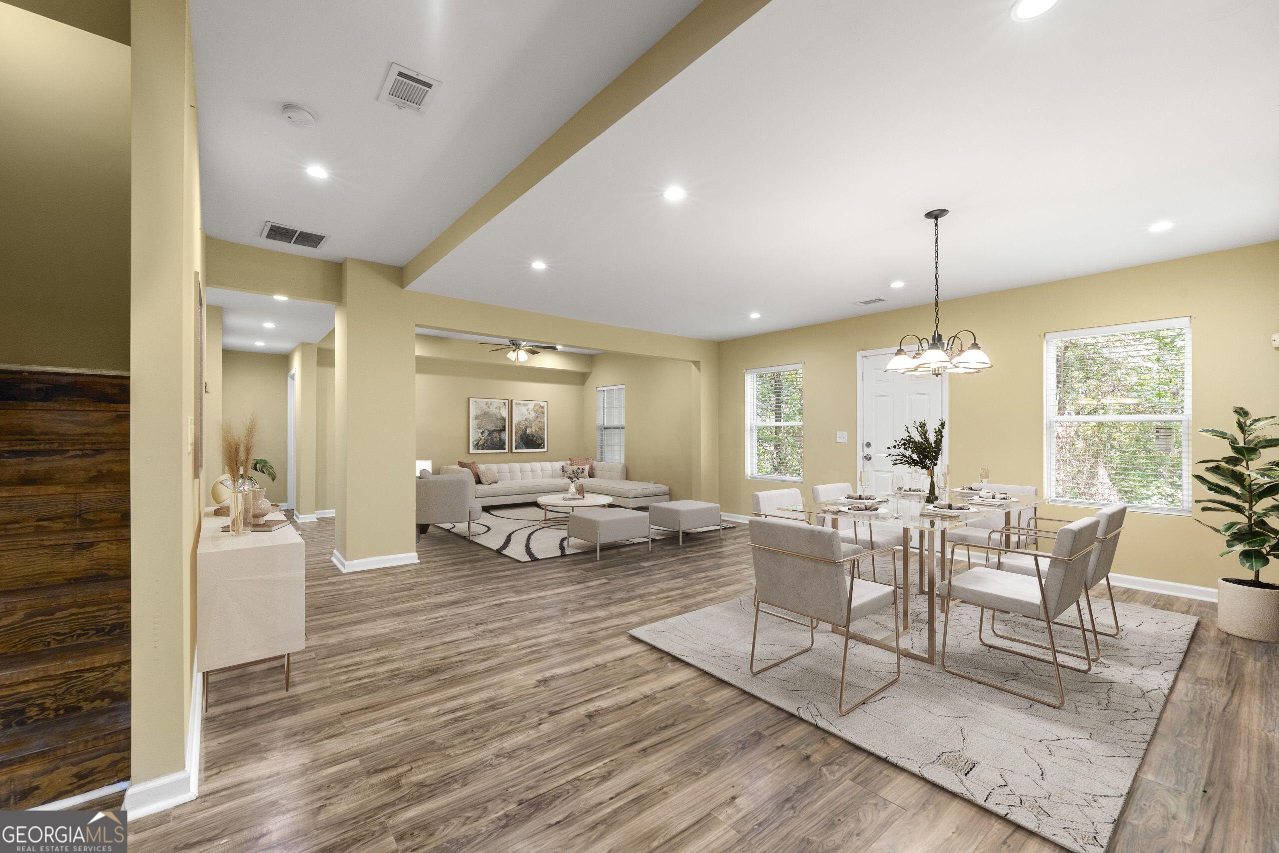 1152 Stepping Stone Lane Conyers, GA 30012 - Photo 4 of 9 a view of a livingroom with furniture window and wooden floor