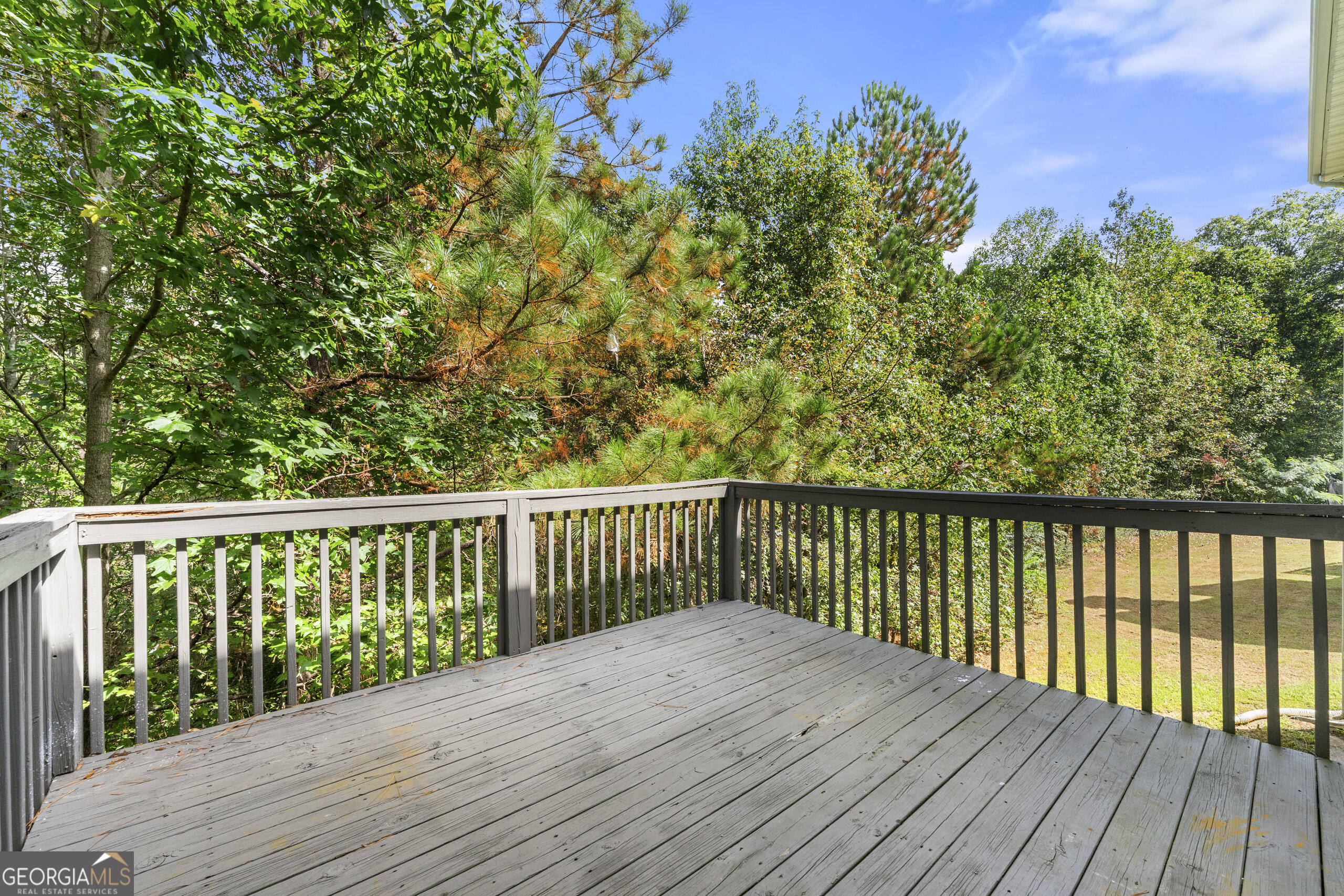 1152 Stepping Stone Lane Conyers, GA 30012 - Photo 7 of 9 a balcony with wooden floor and fence