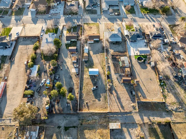 an aerial view of residential houses and outdoor space
