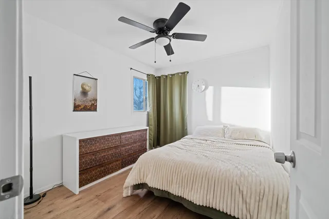 a bedroom with a bed and window