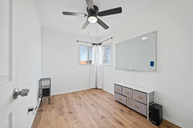 a bedroom with a bed and a dresser