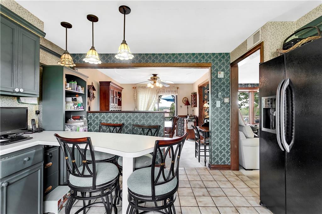 532 Valley View Road Eighty Four, PA 15330 - Photo 11 of 25 a room with stainless steel appliances kitchen island granite countertop furniture and a refrigerator