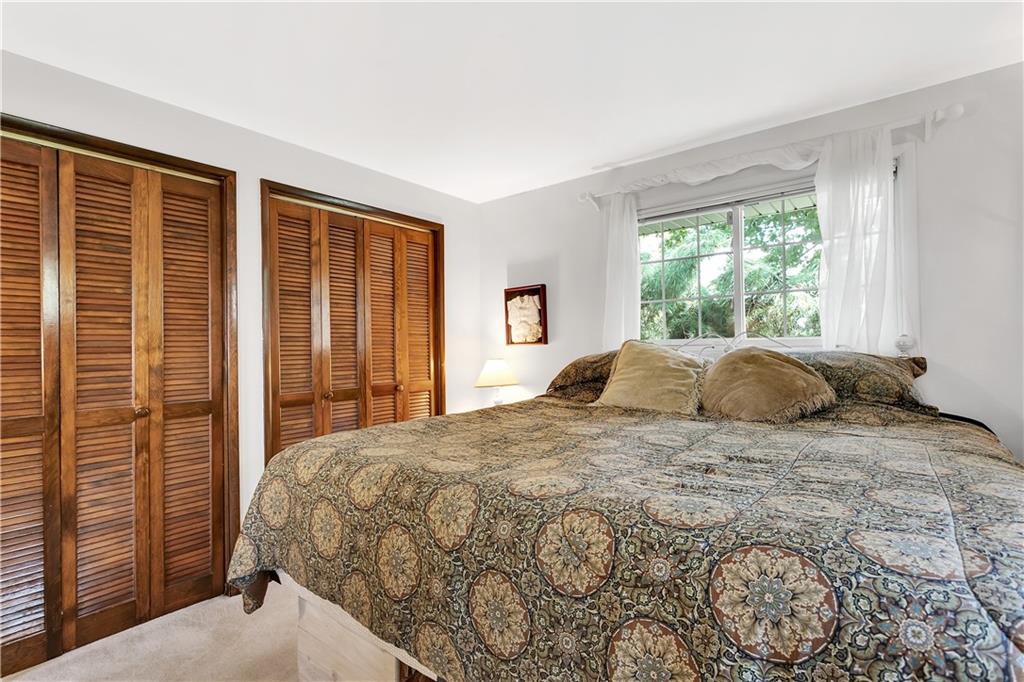 532 Valley View Road Eighty Four, PA 15330 - Photo 13 of 25 a large bed sitting in a bedroom next to a window