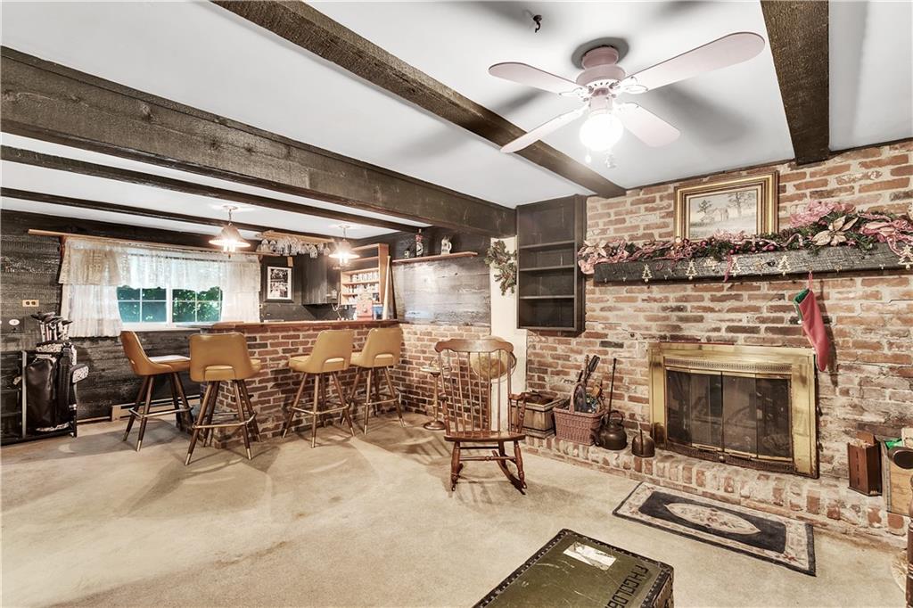532 Valley View Road Eighty Four, PA 15330 - Photo 17 of 25 a living room with furniture a fireplace and a ceiling fan