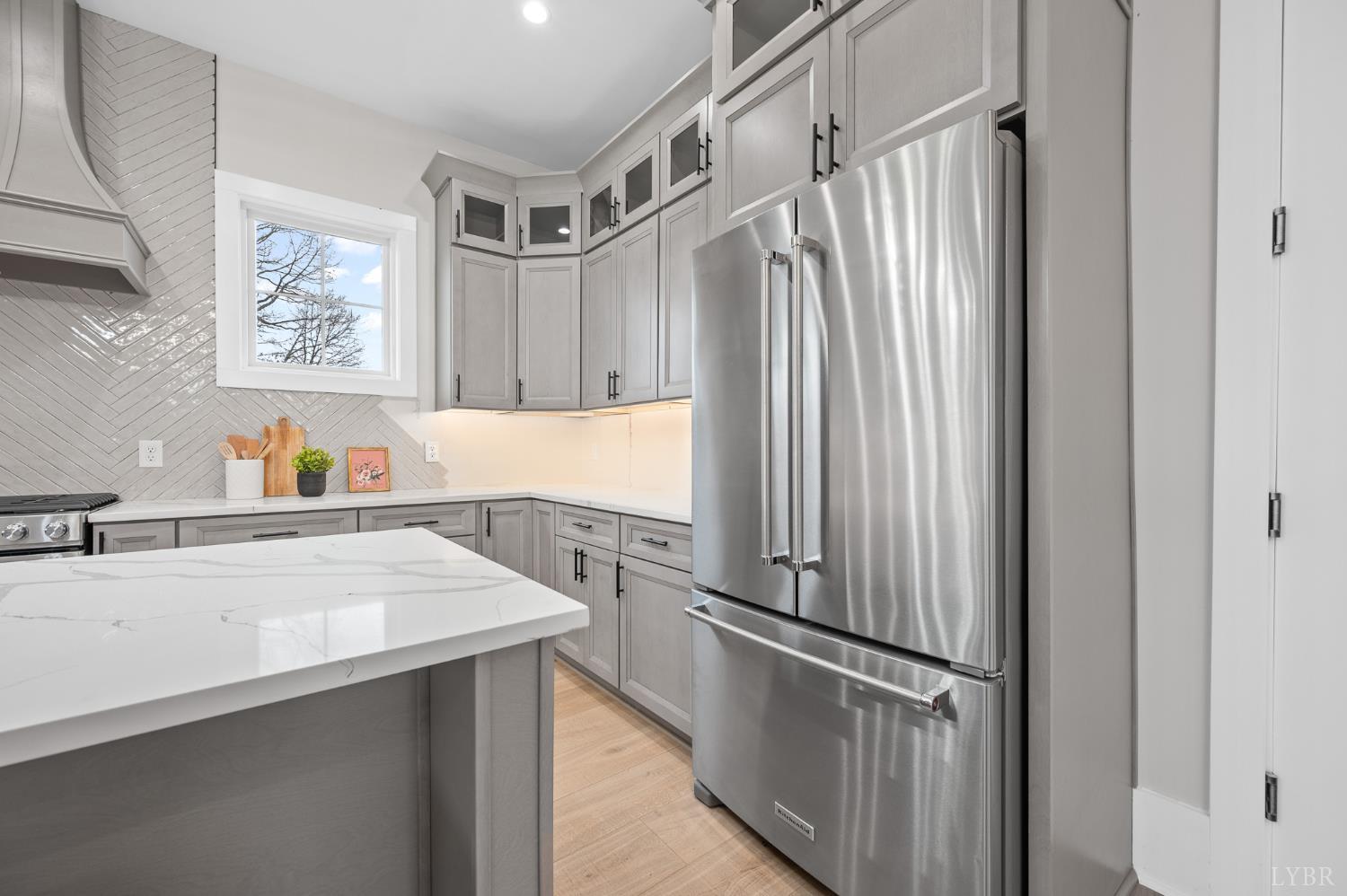3741 Lowry Road Goode, VA 24556 - Photo 12 of 54 a kitchen with stainless steel appliances a refrigerator and a sink