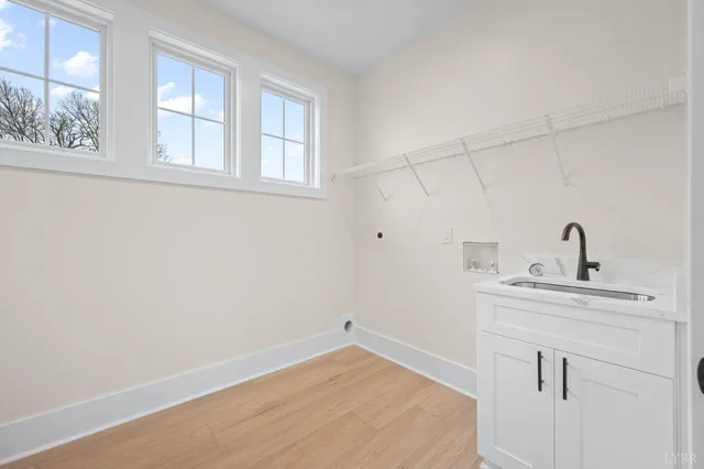 a room with a sink and cabinets