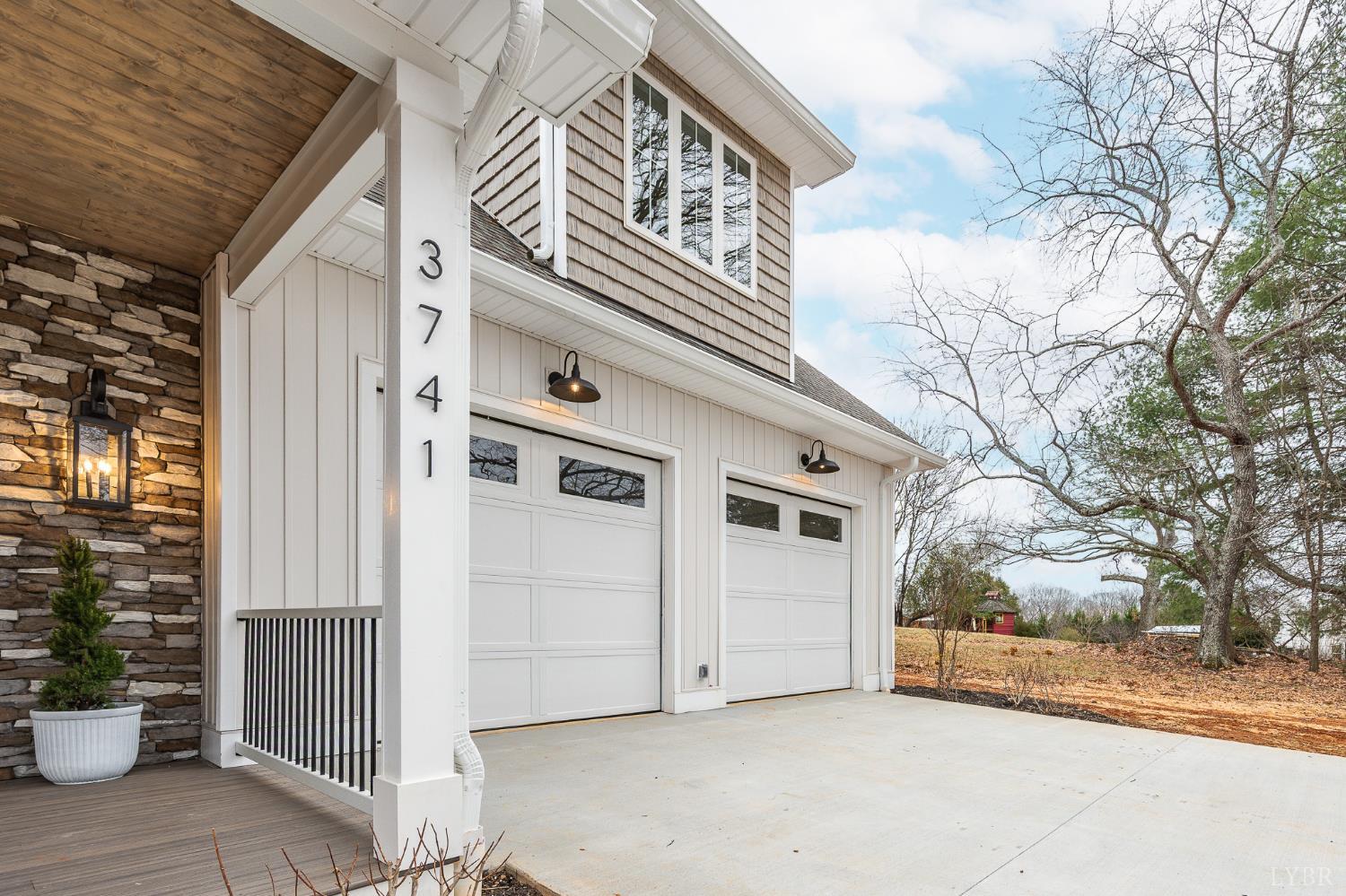 3741 Lowry Road Goode, VA 24556 - Photo 37 of 54 a view of a house with a large tree