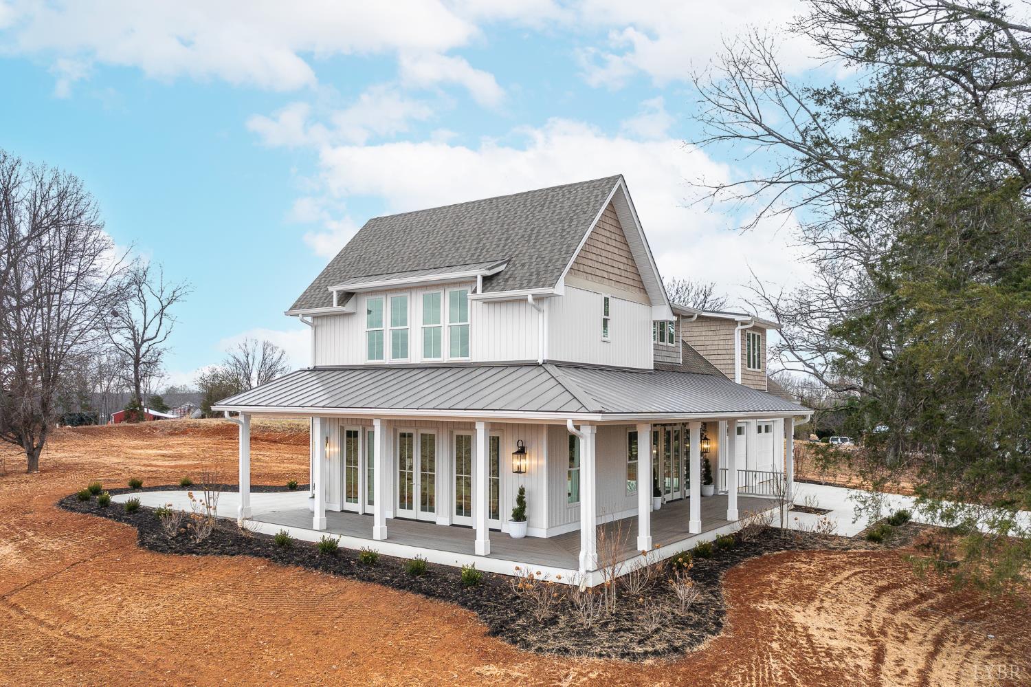 3741 Lowry Road Goode, VA 24556 - Photo 45 of 54 a view of a white house with a yard and balcony