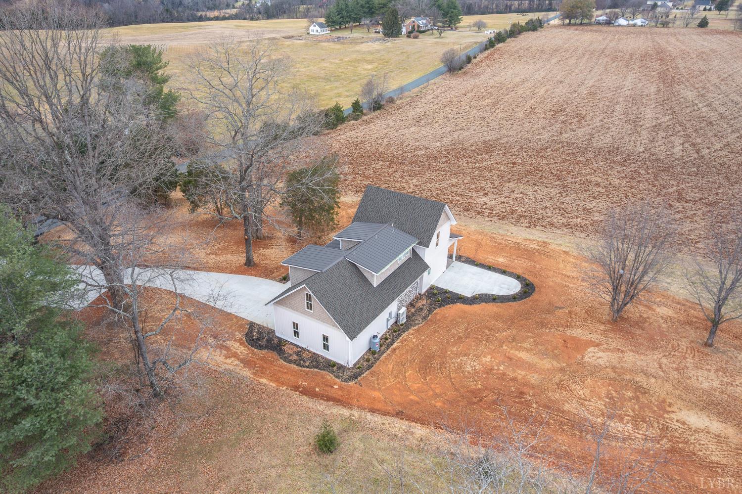 3741 Lowry Road Goode, VA 24556 - Photo 48 of 54 a view of a yard with large trees