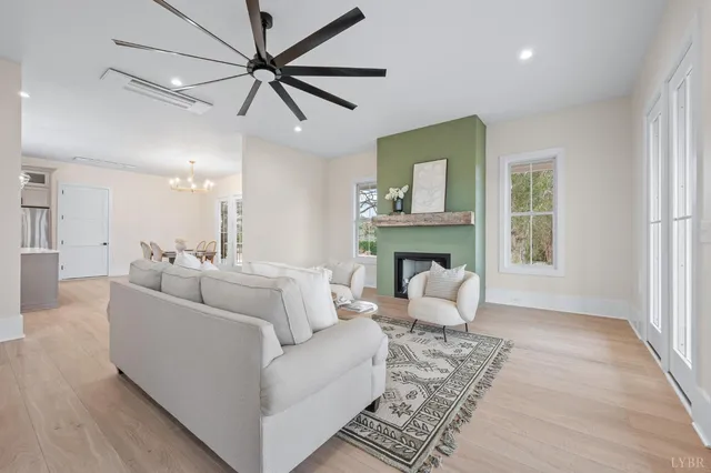 a living room with furniture and a fireplace