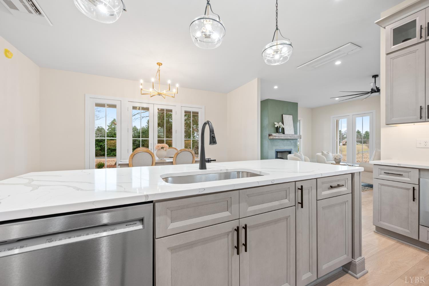 3741 Lowry Road Goode, VA 24556 - Photo 10 of 54 a open kitchen with a sink and dishwasher with white cabinets