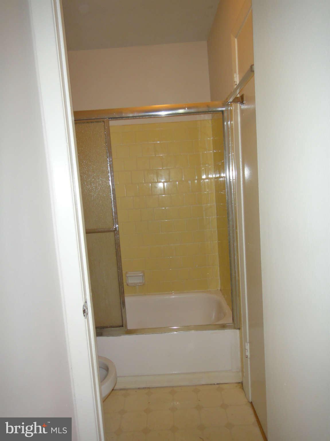 6251 Parallel Lane Columbia, MD 21045 - Photo 13 of 28 a bathroom with a glass shower door