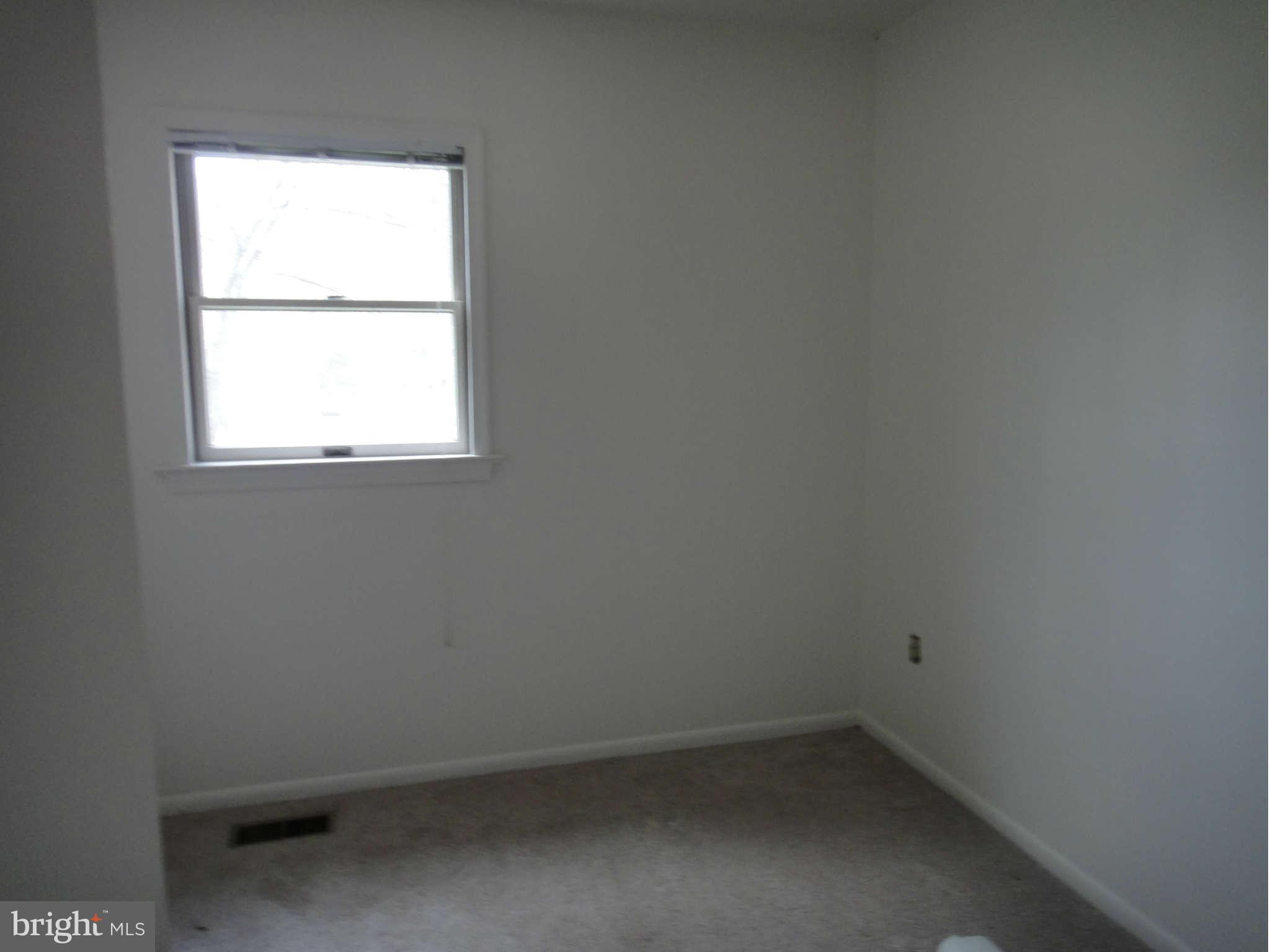 6251 Parallel Lane Columbia, MD 21045 - Photo 16 of 28 an empty room with a window