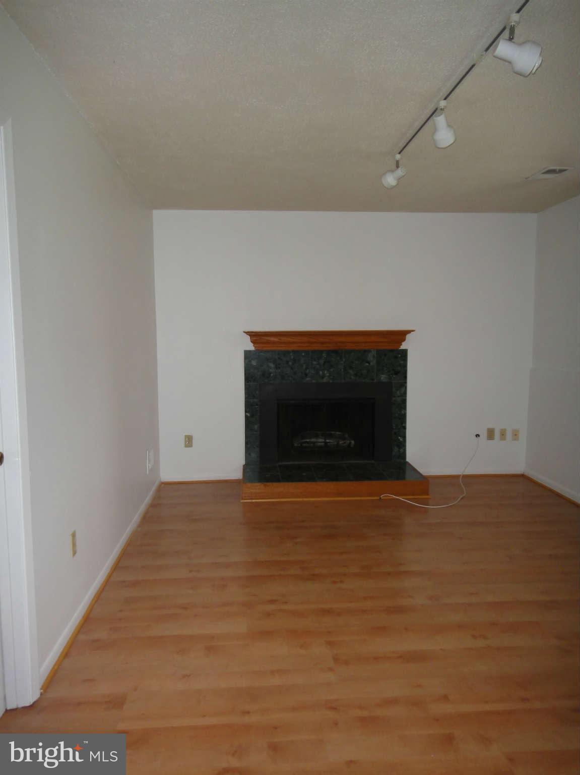 6251 Parallel Lane Columbia, MD 21045 - Photo 19 of 28 a view of empty room with wooden floor