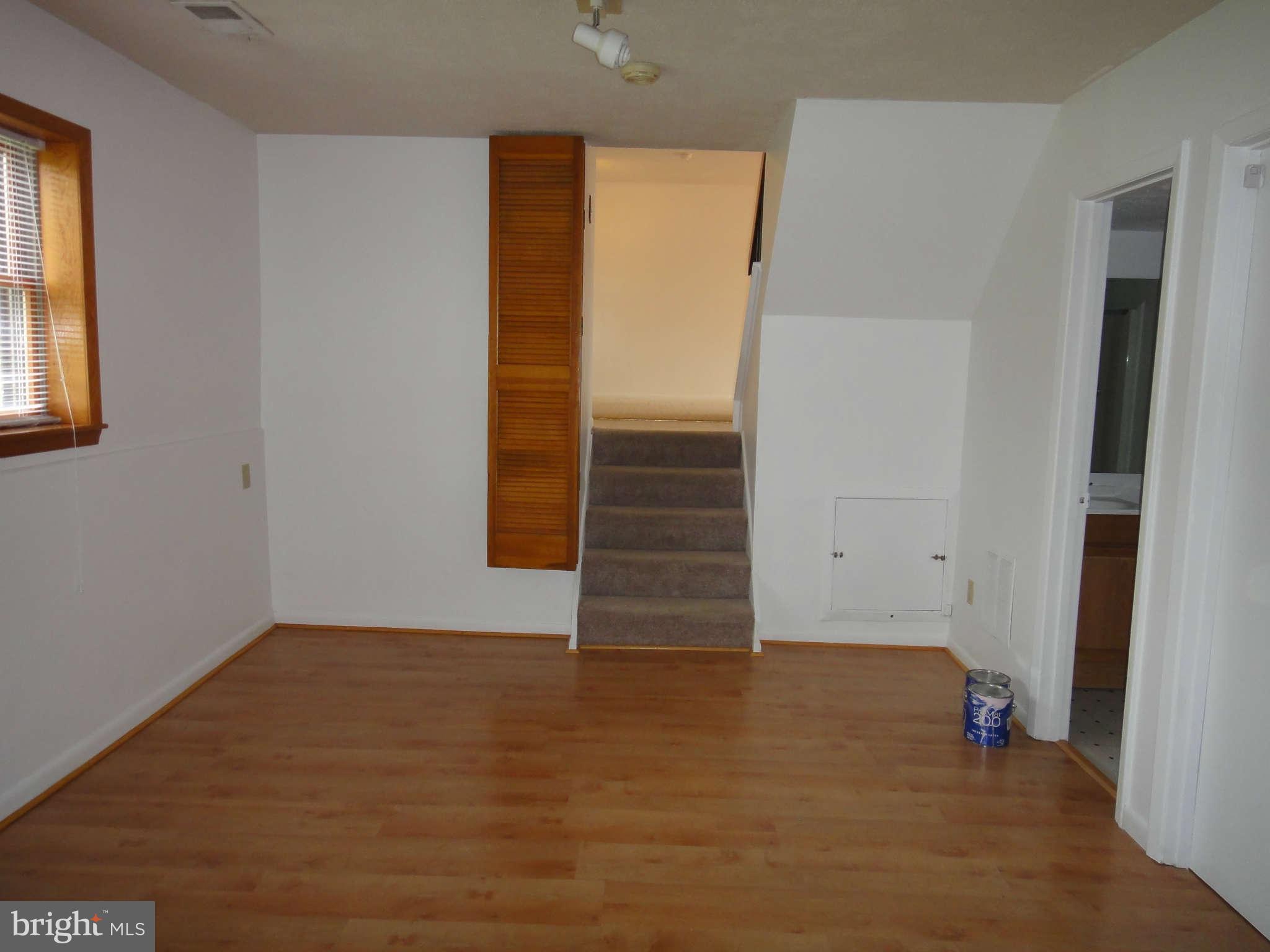 6251 Parallel Lane Columbia, MD 21045 - Photo 20 of 28 an empty room with wooden floor and windows