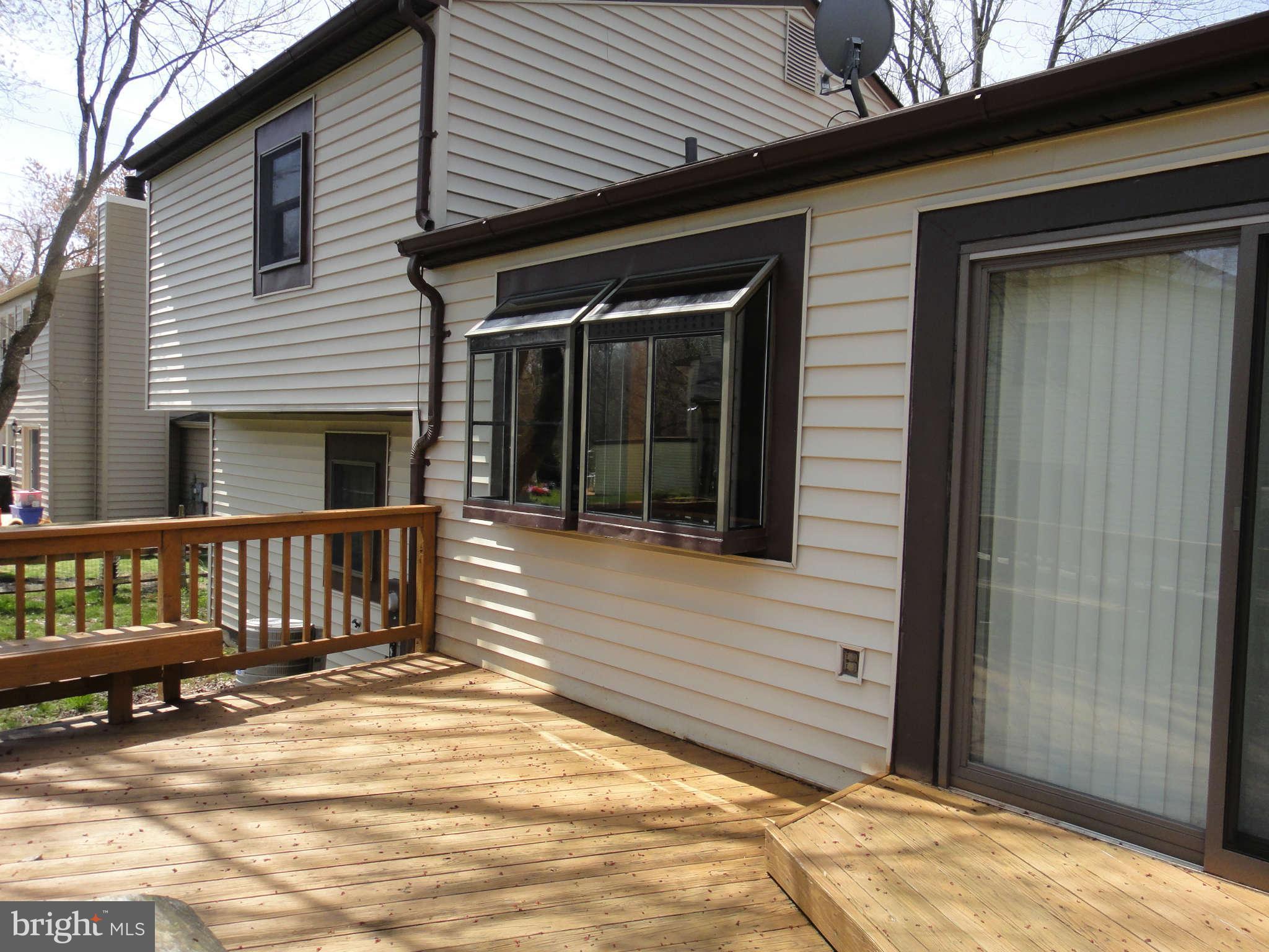 6251 Parallel Lane Columbia, MD 21045 - Photo 24 of 28 a view of a house with a wooden fence