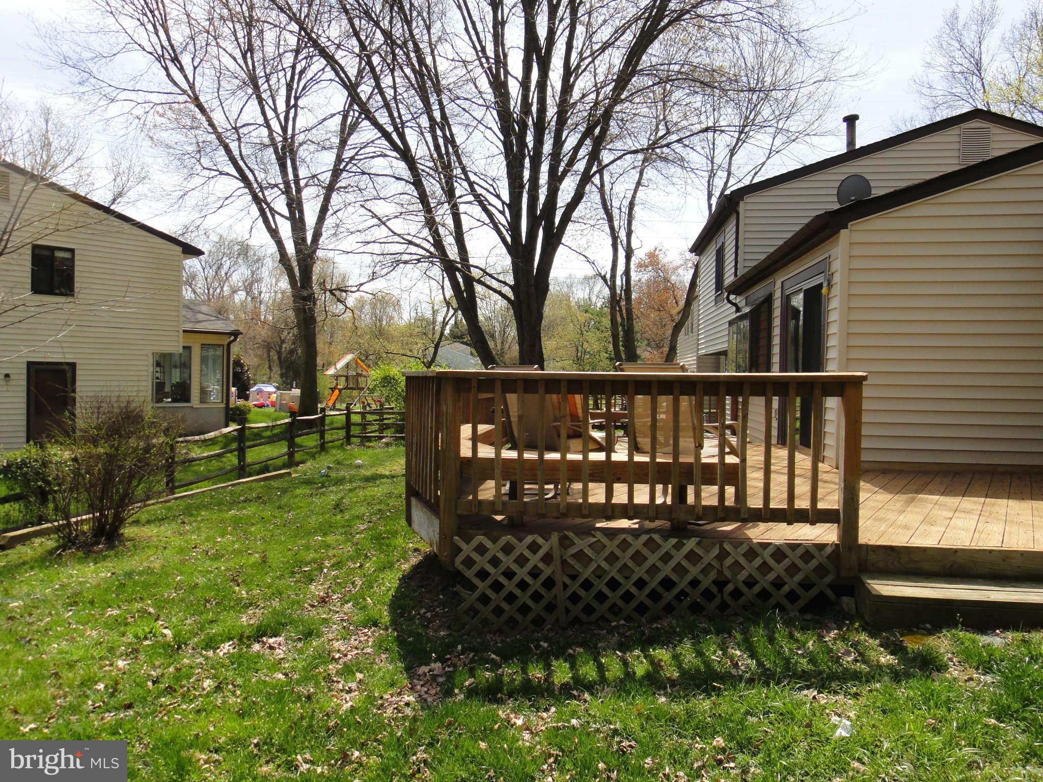6251 Parallel Lane Columbia, MD 21045 - Photo 26 of 28 a view of a house with backyard and sitting area