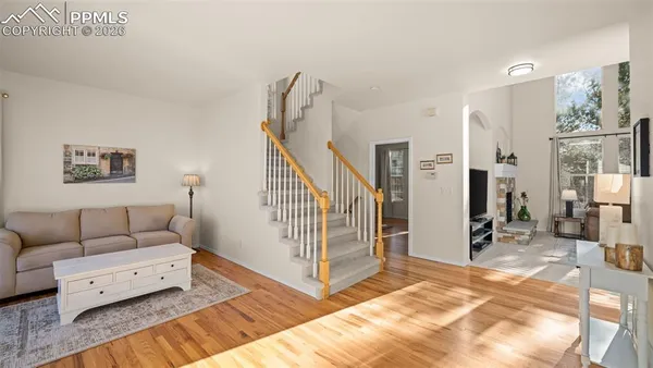a living room with furniture and a rug