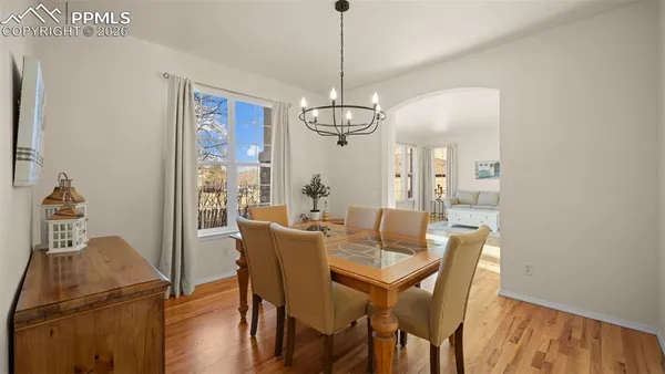 a view of a dining room with furniture window and wooden floor