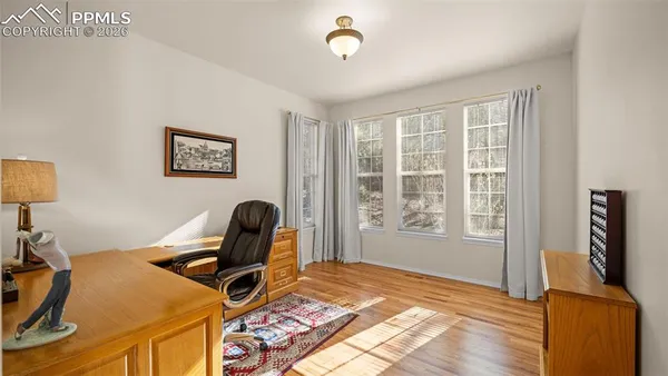 a room with gym equipment and a window