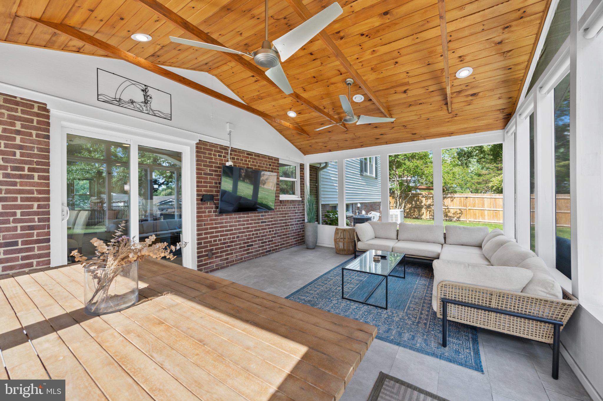 6705 New Hope Drive Springfield, VA 22151 - Photo 52 of 67 Inviting sunlit porch with rustic charm.