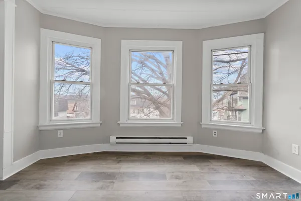a view of a livingroom with an empty space and window