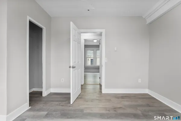 an empty room with wooden & door