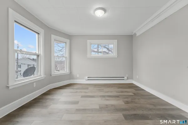 a view of an empty room with a window