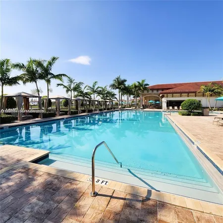 a swimming pool with outdoor seating and yard