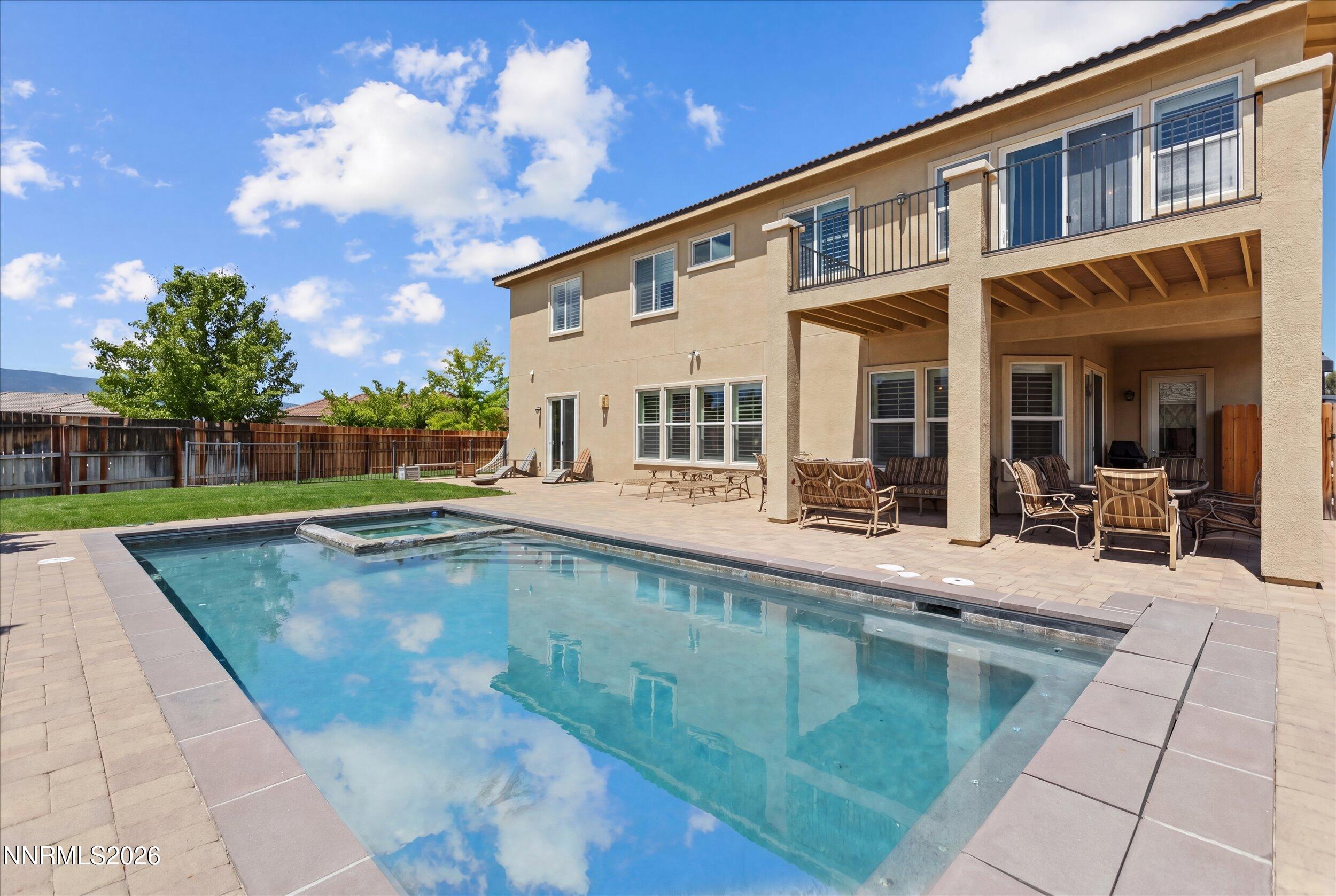 2920 Bull Rider Drive Reno, NV 89521 - Photo 42 of 51 a view of a house with swimming pool and sitting area