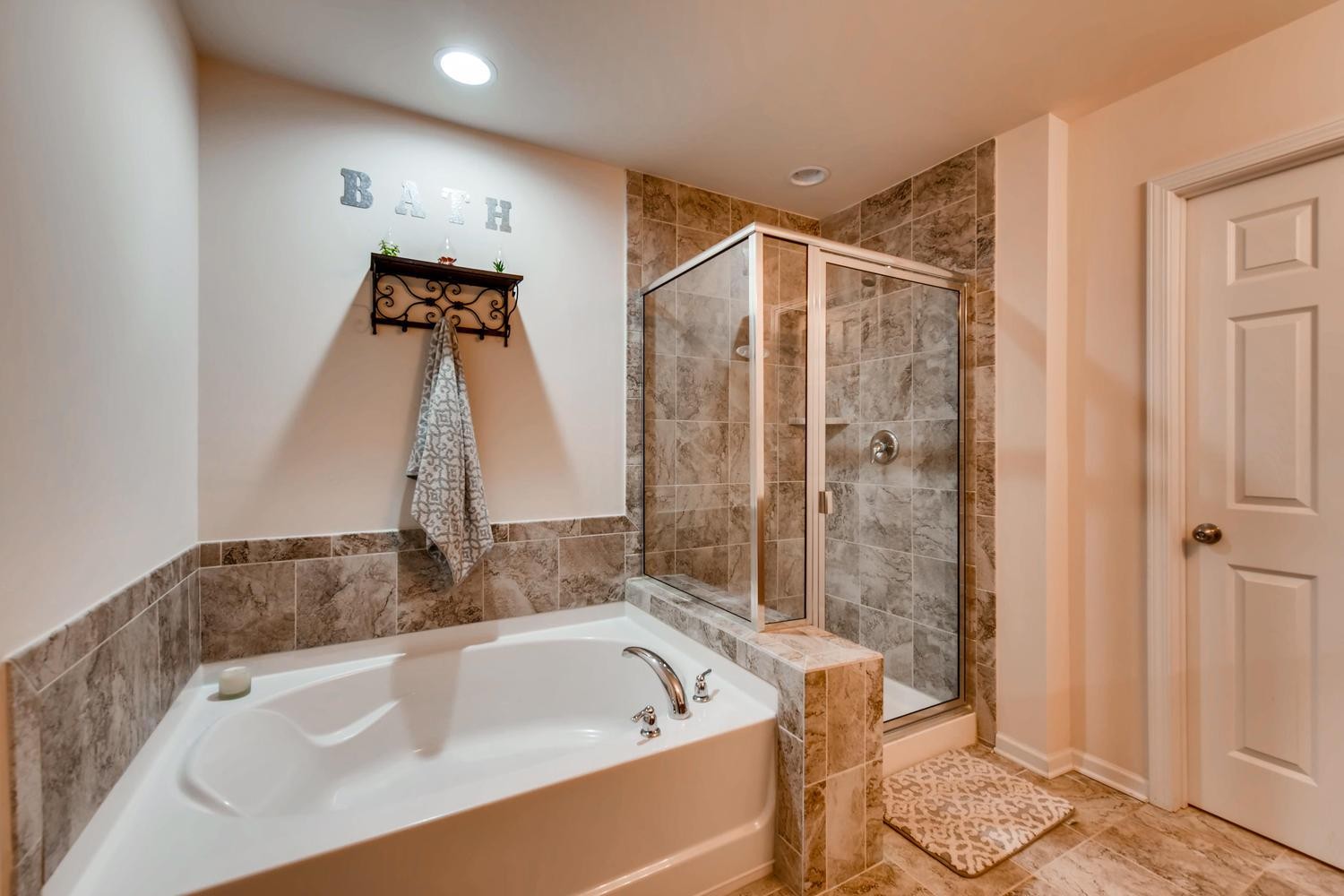 1471 Old Stone Road Lebanon, TN 37087 - Photo 14 of 27 a bathroom with a tub a toilet and shower