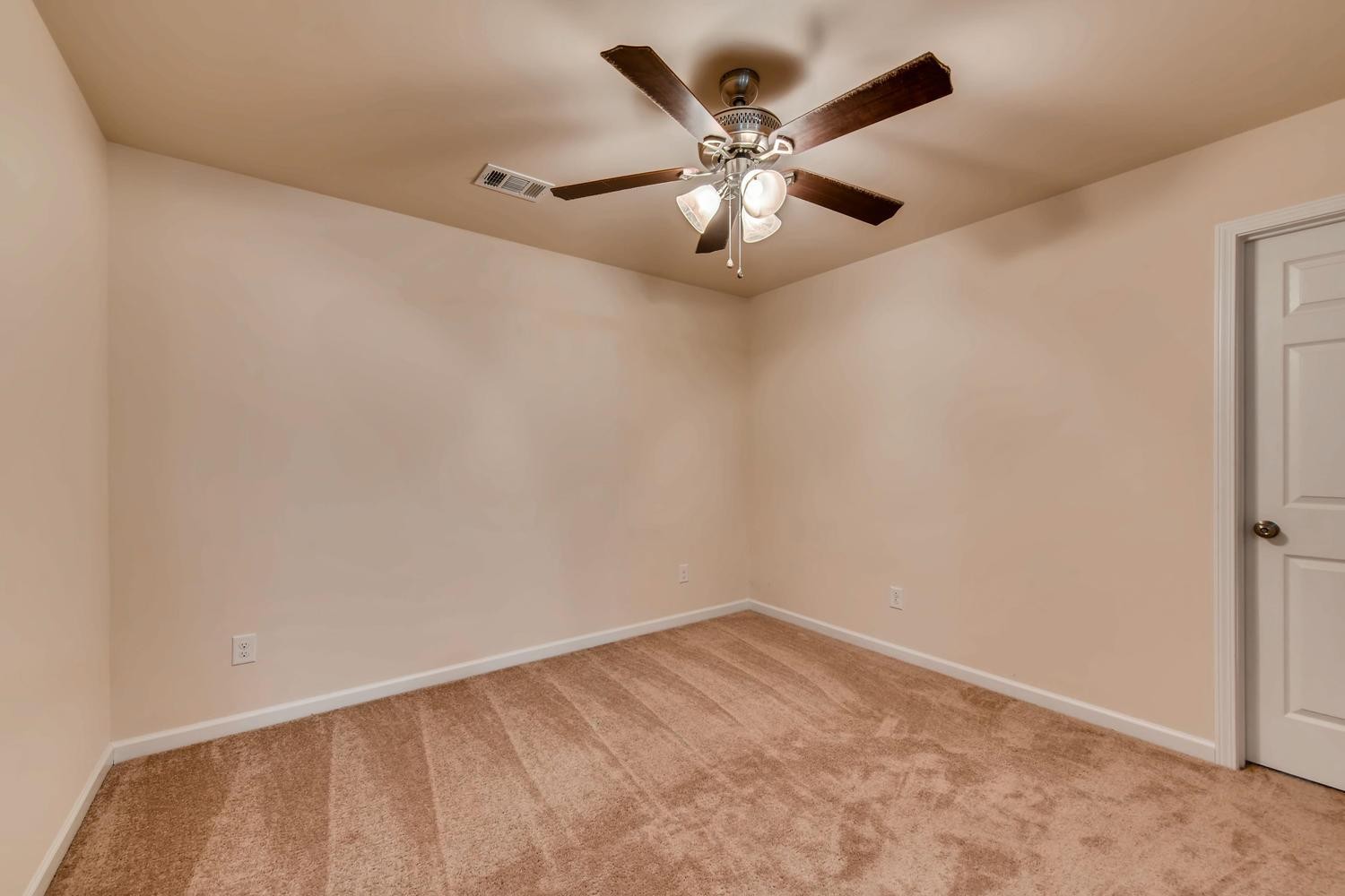 1471 Old Stone Road Lebanon, TN 37087 - Photo 20 of 27 an empty room with a chandelier fan and a wooden floor