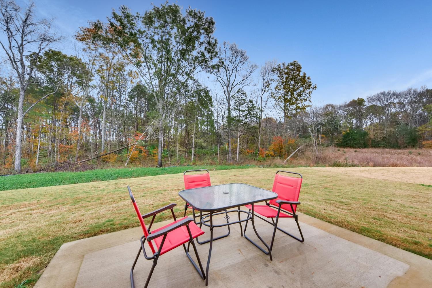 1471 Old Stone Road Lebanon, TN 37087 - Photo 21 of 27 an outdoor sitting area with furniture and umbrella