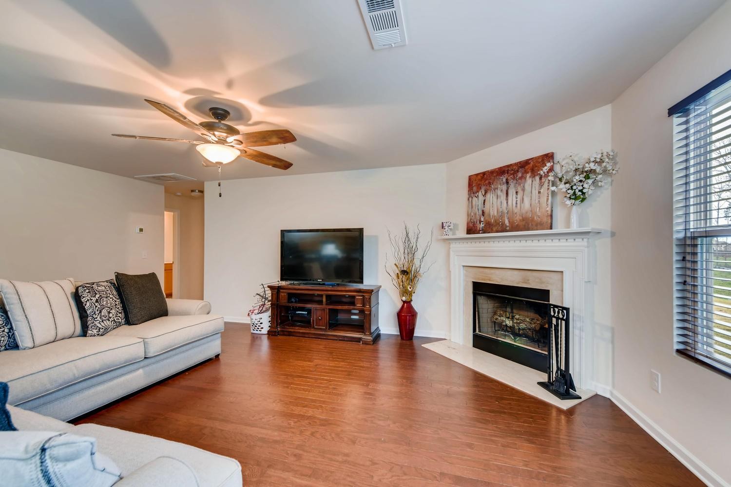 1471 Old Stone Road Lebanon, TN 37087 - Photo 25 of 27 a living room with furniture a fireplace and a flat screen tv