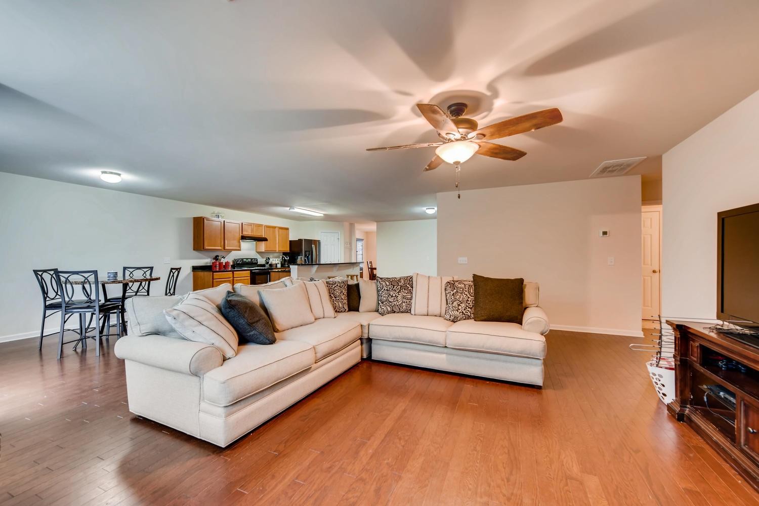 1471 Old Stone Road Lebanon, TN 37087 - Photo 26 of 27 a living room with furniture a flat screen tv and a ceiling fan