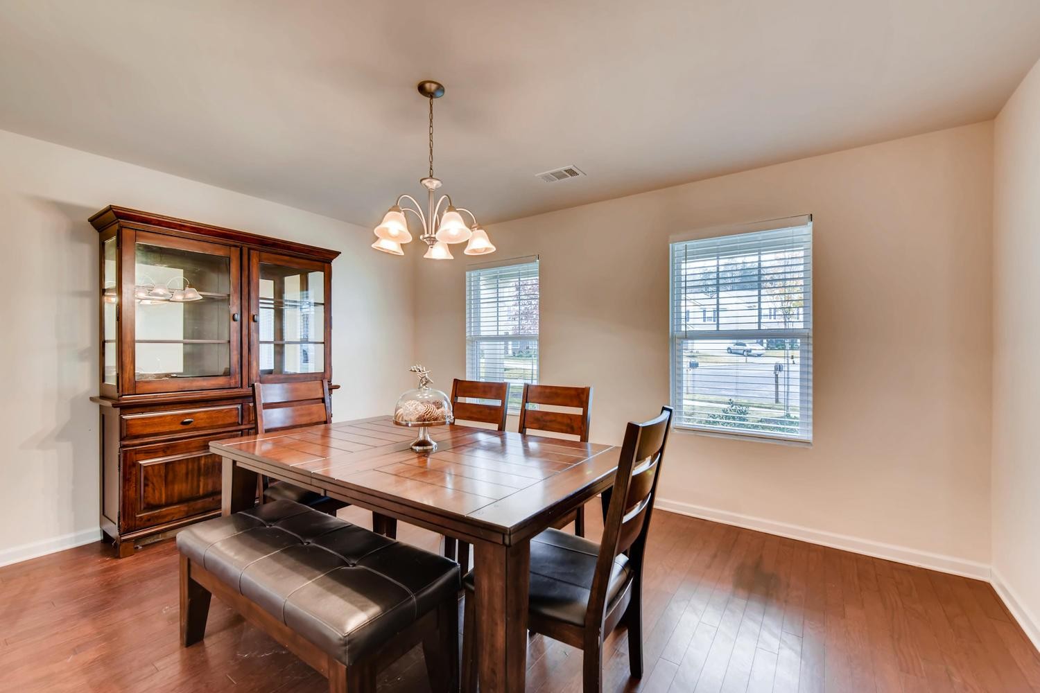 1471 Old Stone Road Lebanon, TN 37087 - Photo 4 of 27 a dining room with wooden floor a chandelier a wooden table and chairs