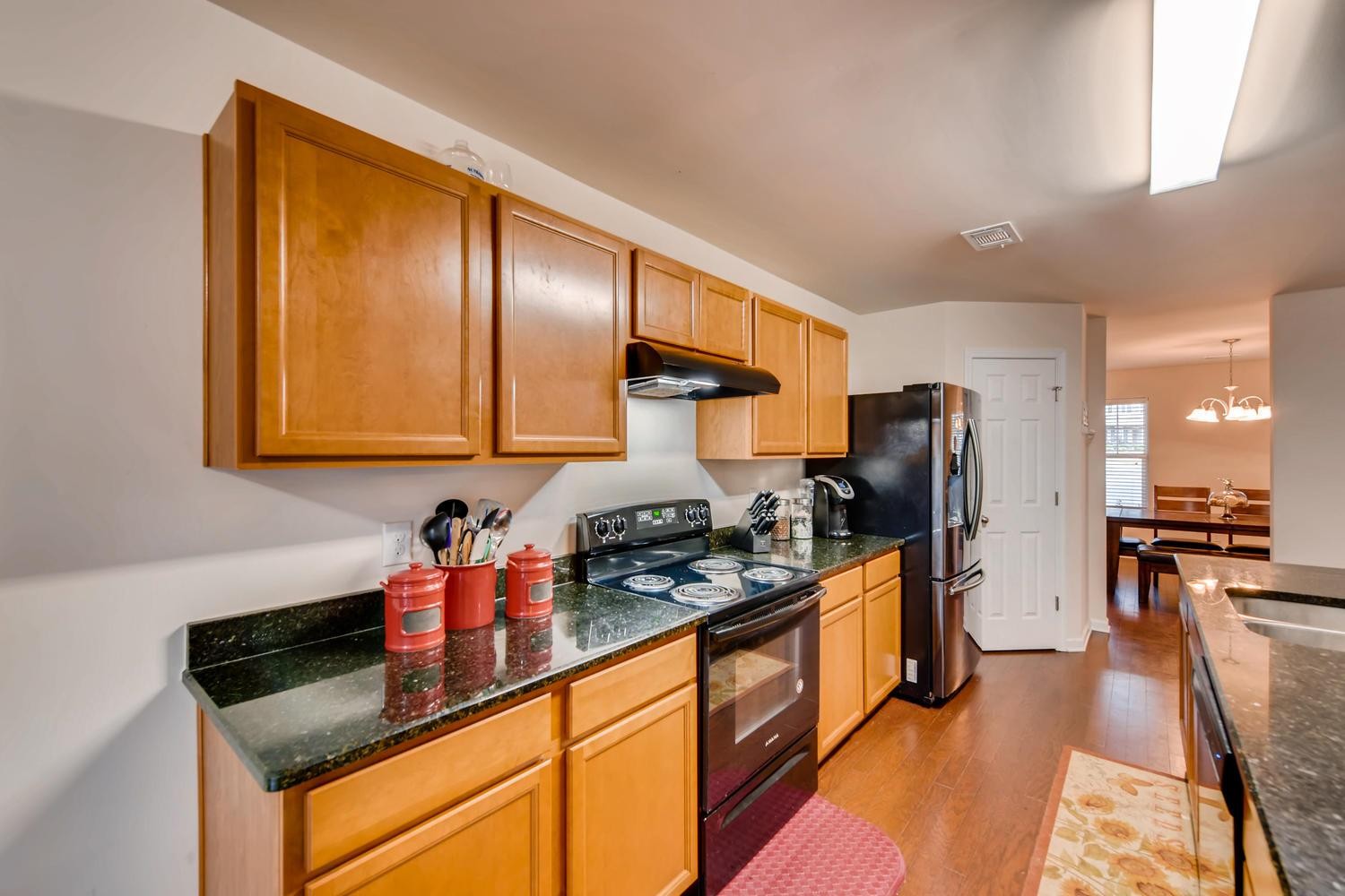 1471 Old Stone Road Lebanon, TN 37087 - Photo 5 of 27 a kitchen with stainless steel appliances granite countertop a sink stove and refrigerator