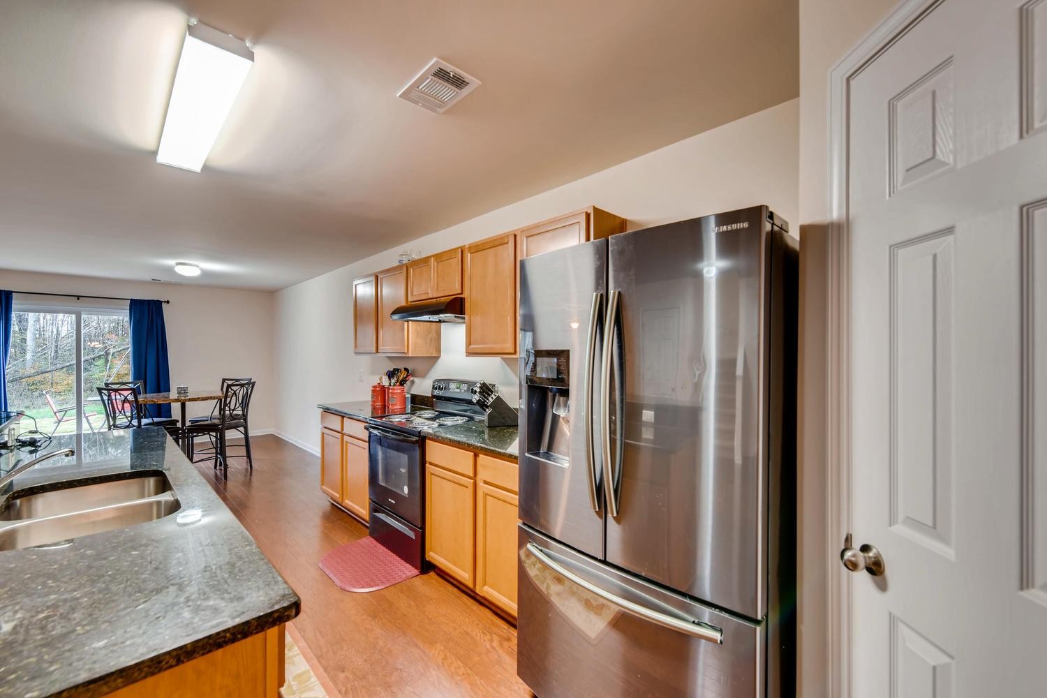 1471 Old Stone Road Lebanon, TN 37087 - Photo 7 of 27 a kitchen with stainless steel appliances granite countertop a refrigerator stove and sink