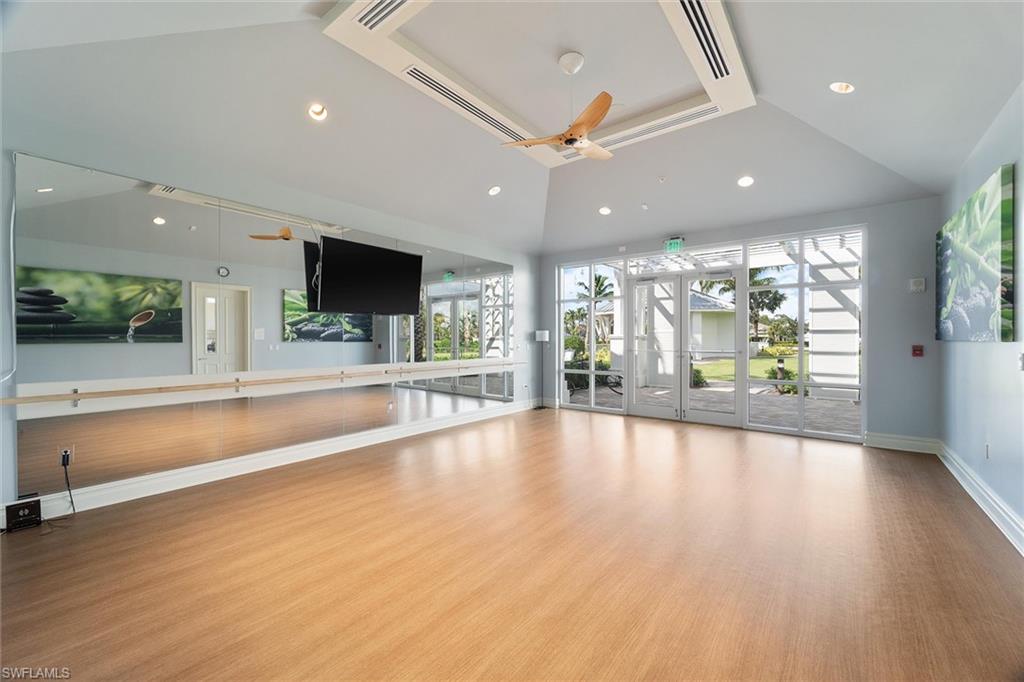 9436 Whooping Crane Way Naples, FL 34120 - Photo 24 of 32 a view of an entryway with wooden floor