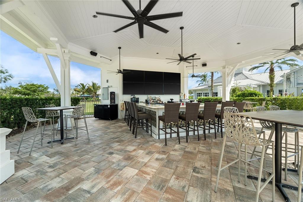 9436 Whooping Crane Way Naples, FL 34120 - Photo 25 of 32 a view of a dining area with furniture