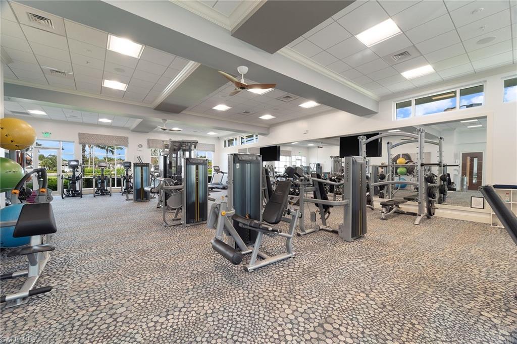 9436 Whooping Crane Way Naples, FL 34120 - Photo 26 of 32 a view of a room with gym equipment