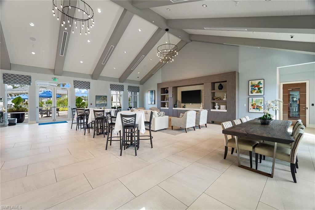 9436 Whooping Crane Way Naples, FL 34120 - Photo 28 of 32 a view of a dining room with furniture