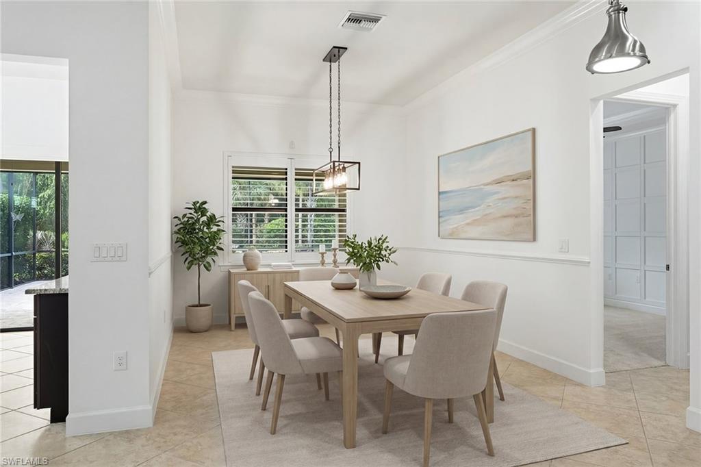9436 Whooping Crane Way Naples, FL 34120 - Photo 8 of 32 a view of a dining room with furniture window and outside view