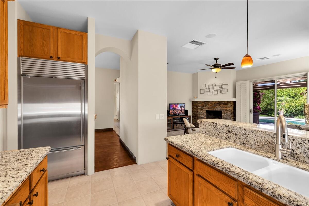 58 Payson Circle Palm Desert, CA 92211 - Photo 14 of 41 a kitchen with granite countertop a sink stainless steel appliances and a counter top space